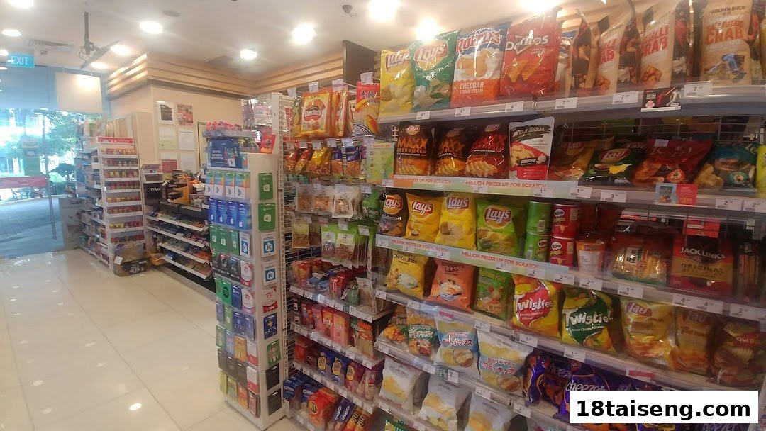 An interior view of a 7-Eleven convenience store, showcasing shelves stocked with various snacks and beverages.