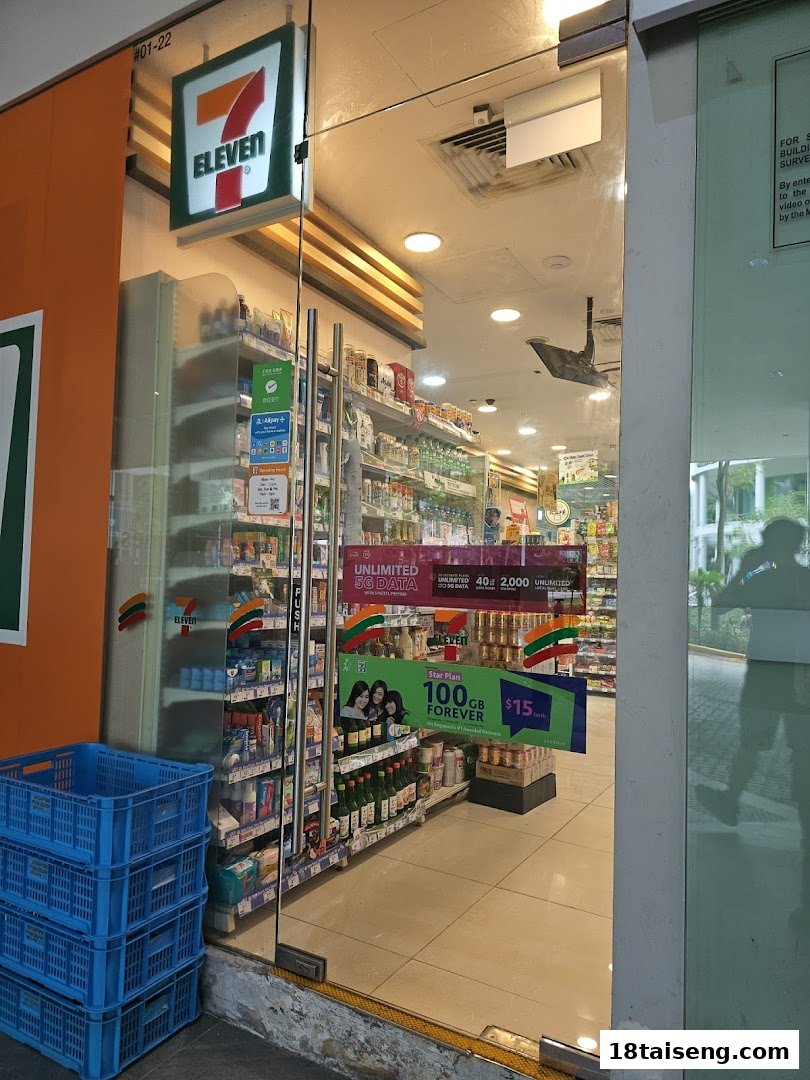 The glass entrance of a 7-Eleven convenience store, showcasing its interior and product displays.