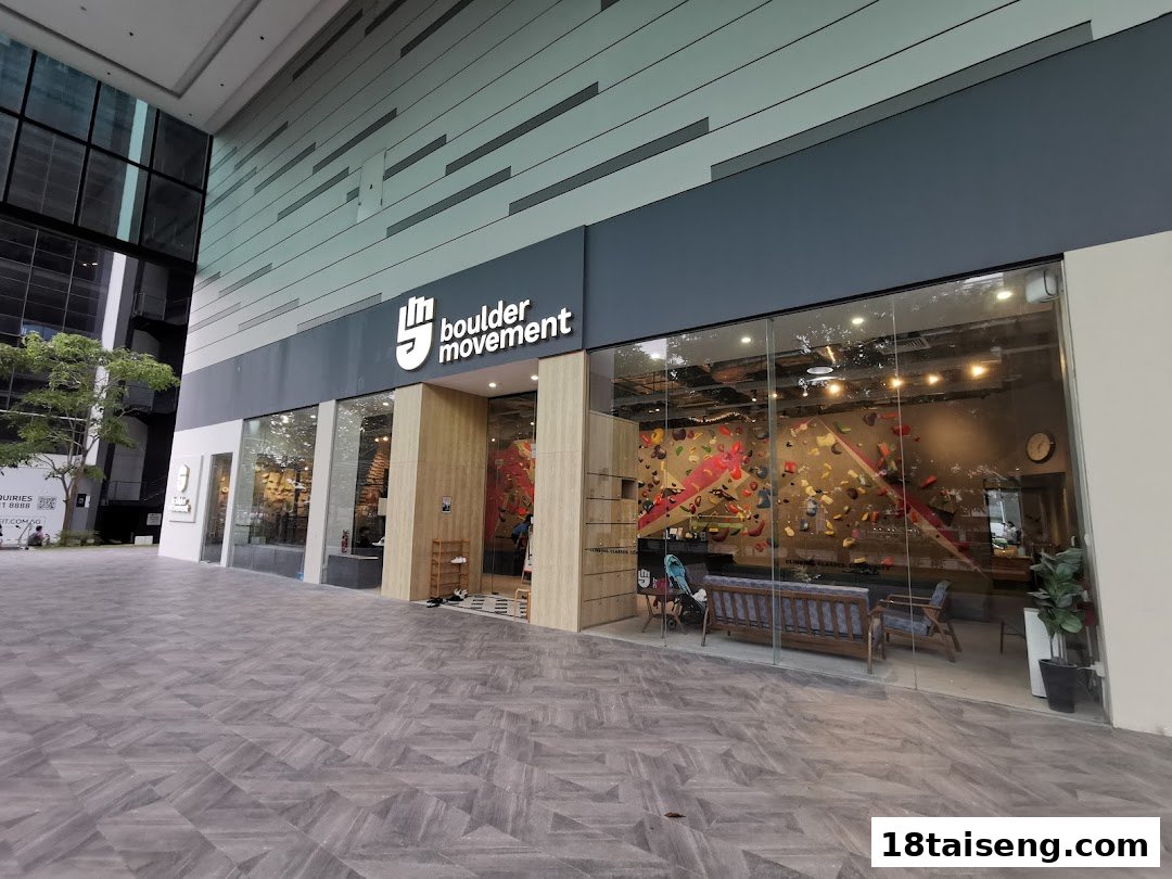 The storefront of Boulder Movement Tai Seng, showcasing its modern entrance and visible indoor climbing wall.