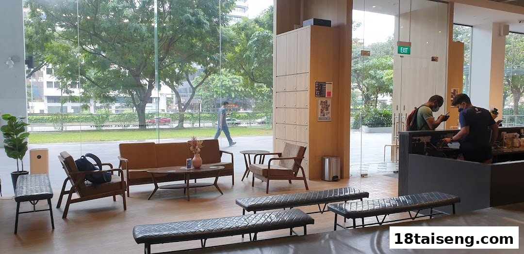 Interior of Boulder Movement Tai Seng, featuring a comfortable lounge area, lockers, and a reception counter.