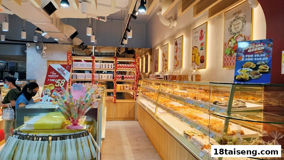 Interior view of Eat Rich bakery, showcasing display cases filled with various pastries and baked goods.