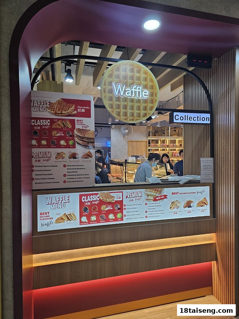 A vibrant waffle shop counter featuring detailed menu boards with various classic and premium waffle flavors.