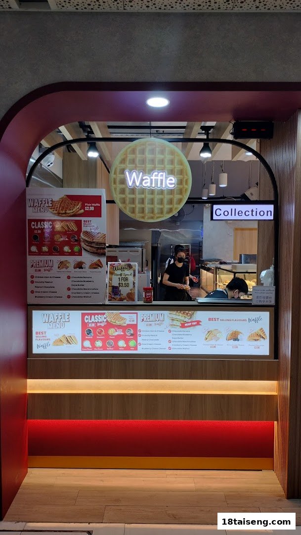 A vibrant waffle shop front with staff, a glowing waffle sign, and detailed menu displays.