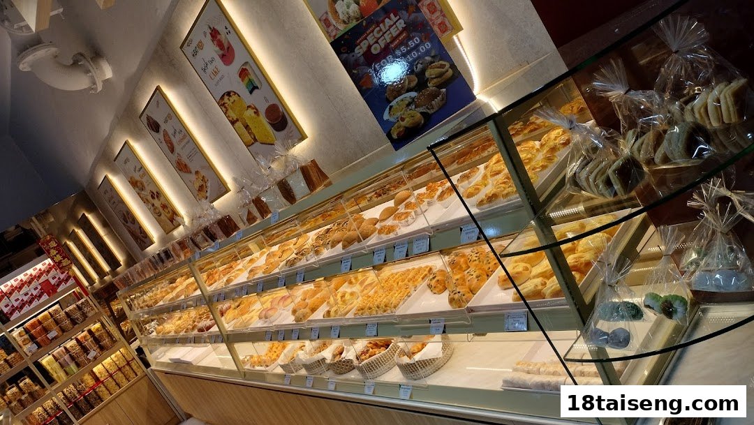 An inviting interior view of Eat Rich bakery, featuring extensive displays of freshly baked pastries, breads, and packaged snacks.
