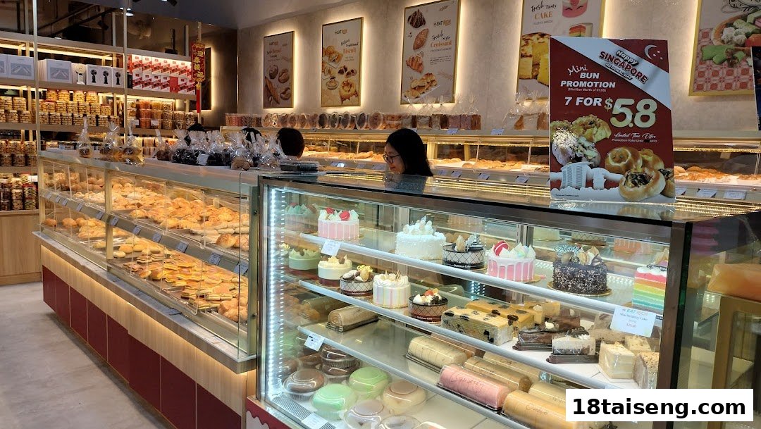 An interior view of Eat Rich bakery, showcasing a wide array of fresh pastries, cakes, and baked goods in display cases.