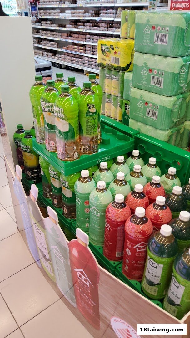 A vibrant supermarket display featuring a variety of bottled teas and beverages, including Heaven and Earth and Authentic Tea House brands.