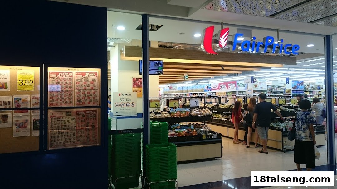 The entrance of FairPrice supermarket, showcasing fresh produce displays and customers entering.