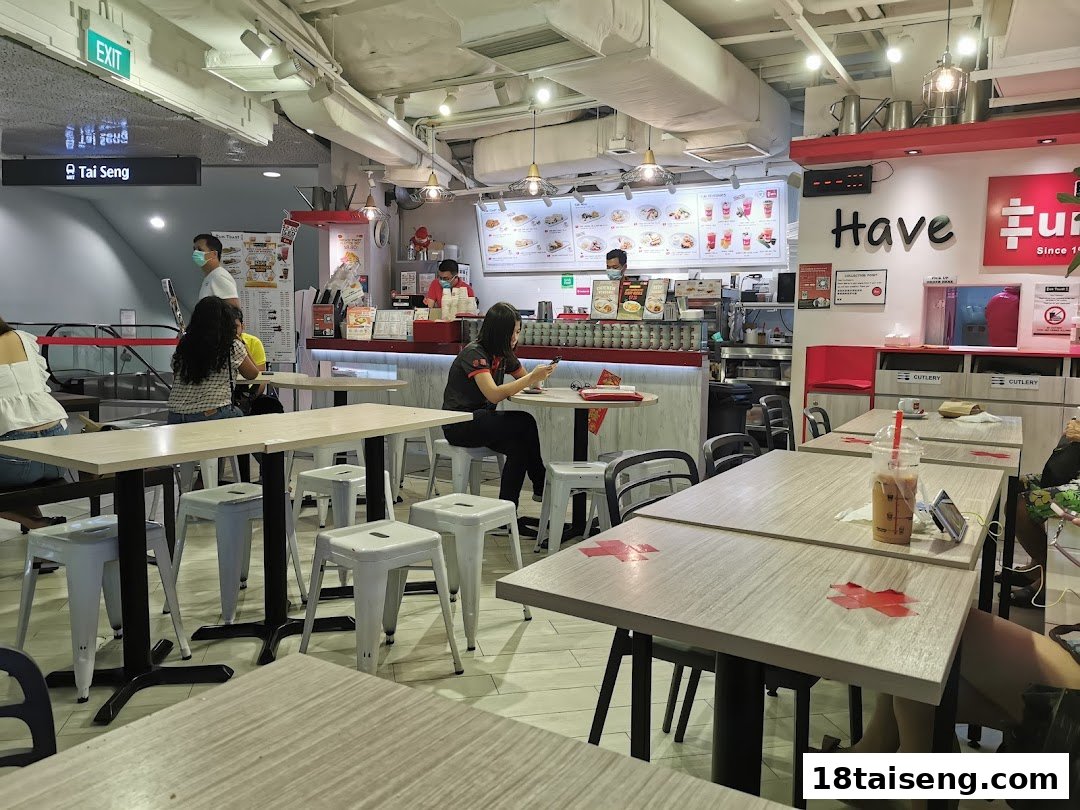 Interior view of Fun Toast cafe with customers, seating, and counter area, showcasing a casual dining atmosphere.