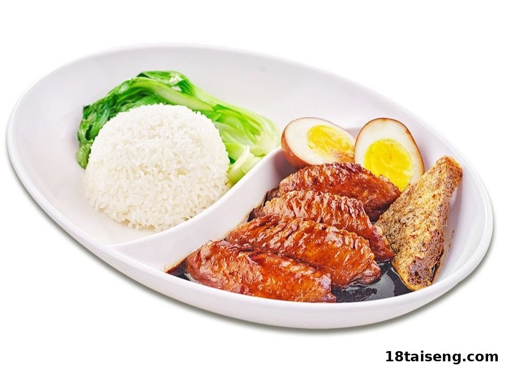 A plate featuring white rice, green vegetables, braised chicken wings, braised eggs, and fried beancurd.