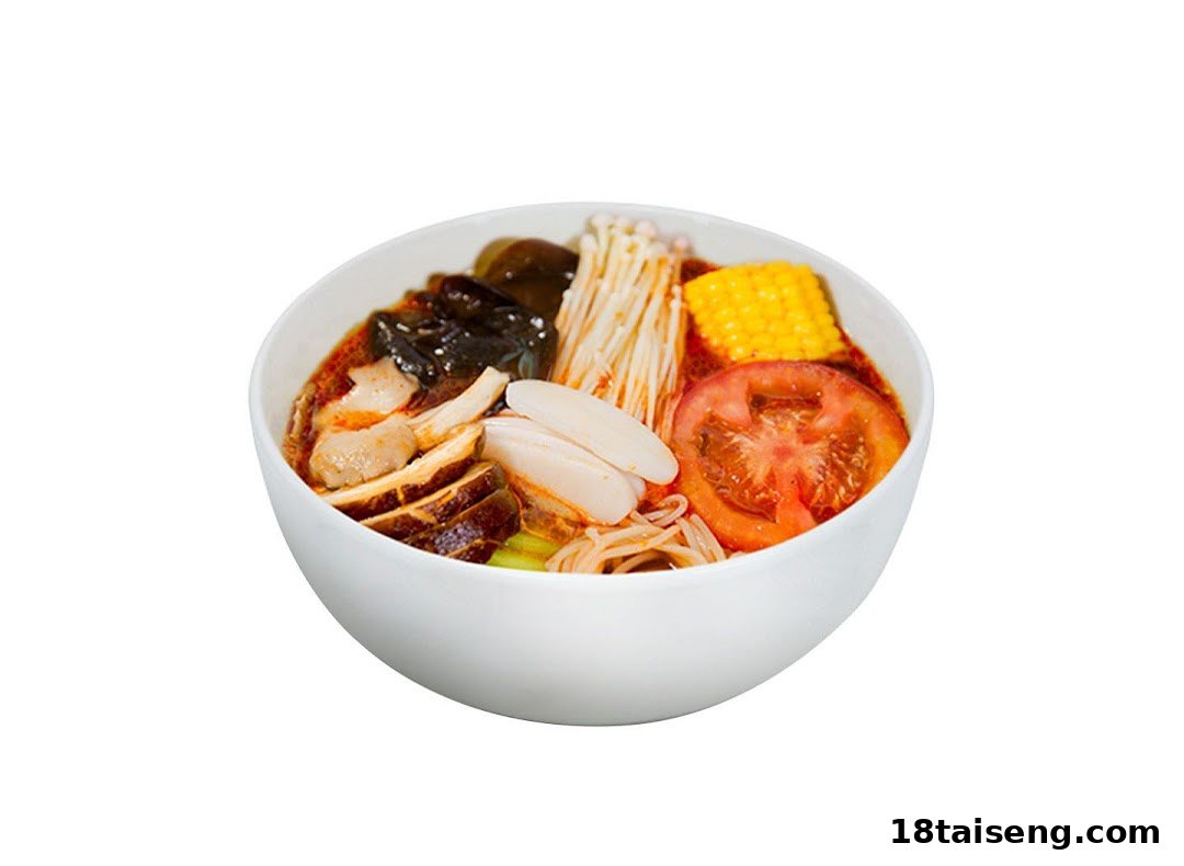 A vibrant bowl of Mala Tang featuring various ingredients like mushrooms, corn, tomato, and noodles.