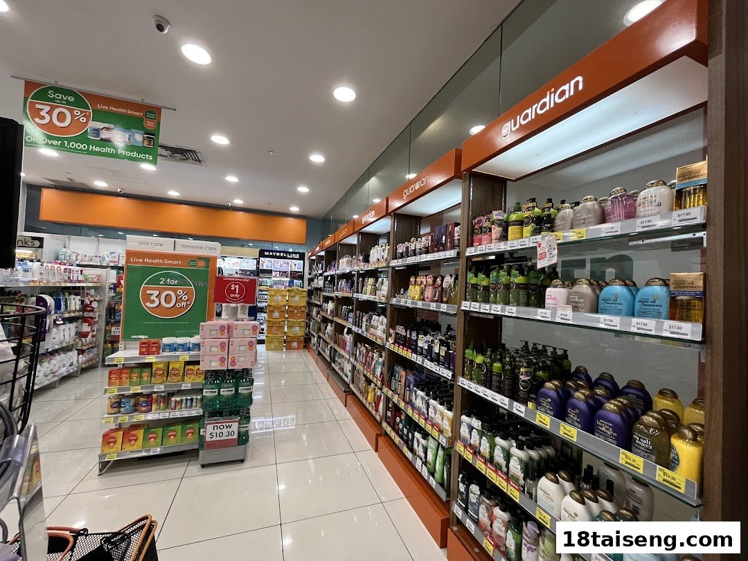 An interior view of a Guardian Health & Beauty store, showcasing aisles stocked with various health and beauty products.