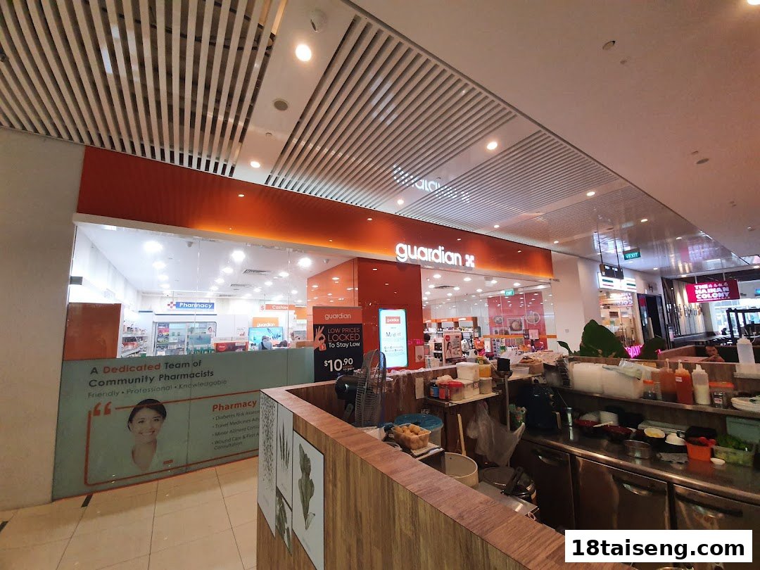 Interior view of Guardian Health & Beauty, showcasing its pharmacy services and product displays.