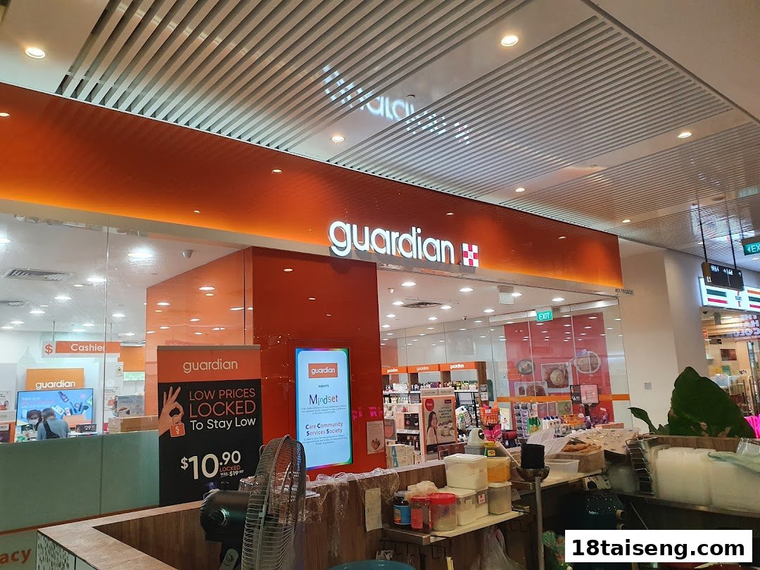 The vibrant orange facade of Guardian Health & Beauty, showcasing its inviting entrance and interior.