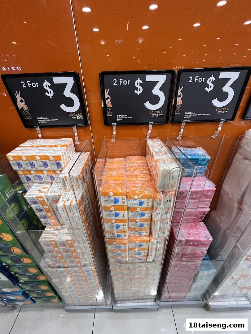 A retail display at Guardian Health & Beauty featuring tissue packs with a '2 For $3' promotion.