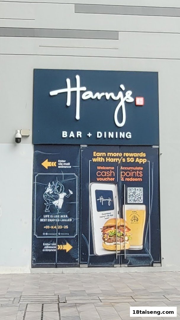 The exterior entrance of Harry's Bar + Dining, featuring signage and promotional decals.
