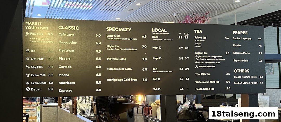 A detailed menu board displaying coffee, tea, frappe, and local drink options with prices.