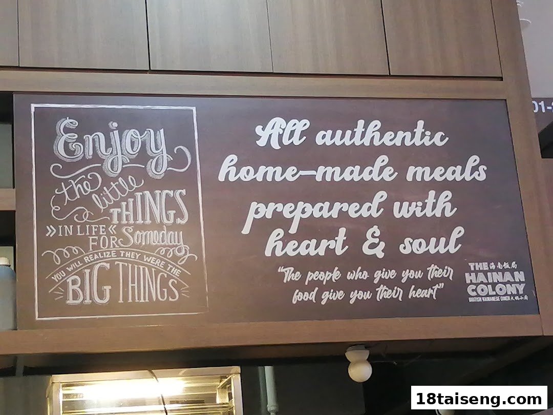 A sign inside The Hainan Colony displaying motivational quotes and their food philosophy.