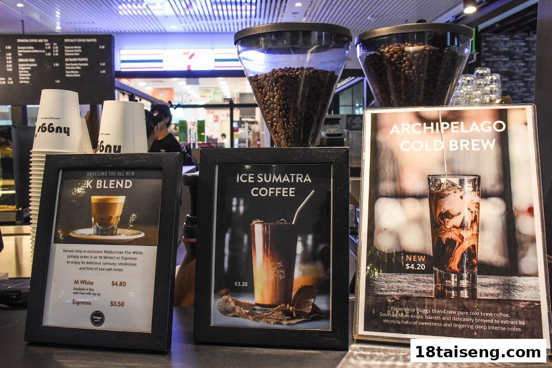 Promotional displays showcasing various coffee drinks and their prices at Huggs Coffee.