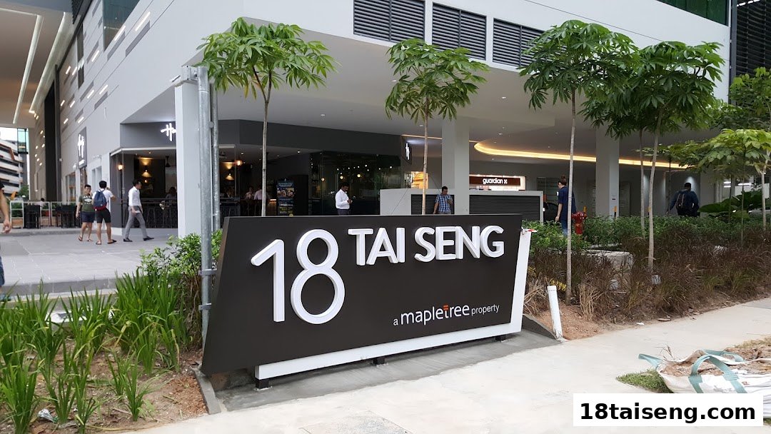 Exterior view of 18 Tai Seng building, featuring the entrance to Jalan Kayu The Prata Cafe.