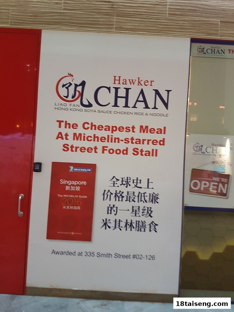 Shopfront sign for Hawker Chan, promoting its Michelin-starred status and affordable street food.