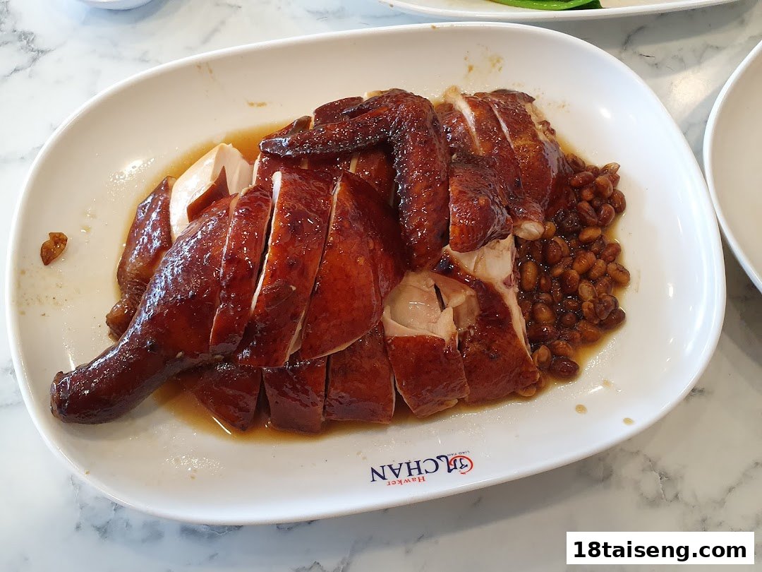 A plate of succulent roasted chicken with a rich sauce and soybeans.