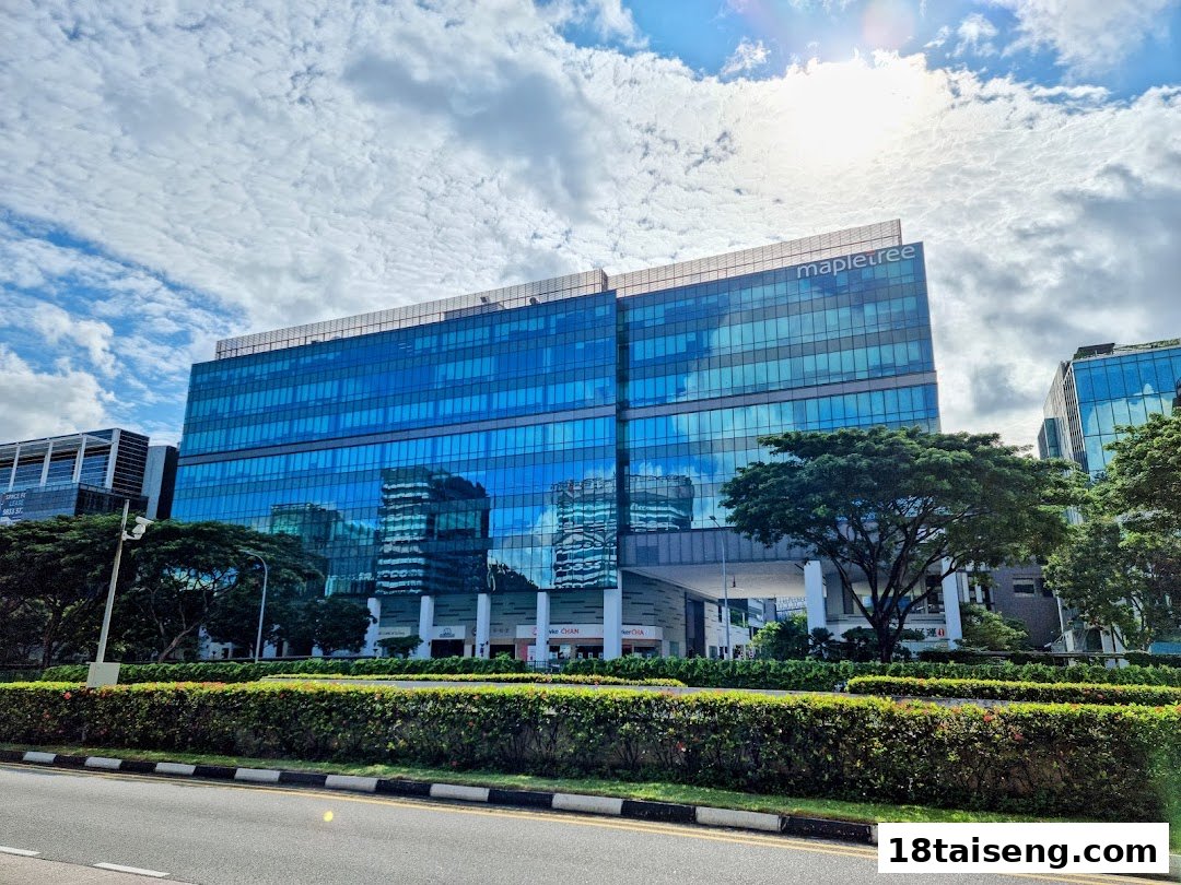 Exterior view of the modern Mapletree building in Tai Seng, home to various eateries.