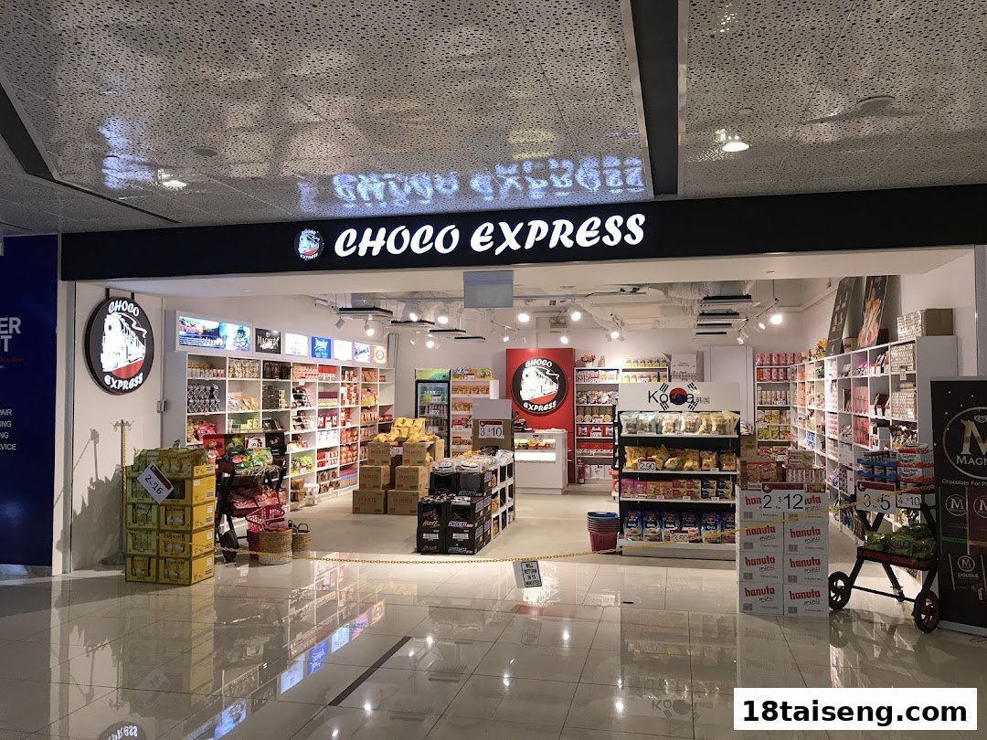 The storefront of Choco Express, a snack shop, displaying a wide variety of chocolates and treats.