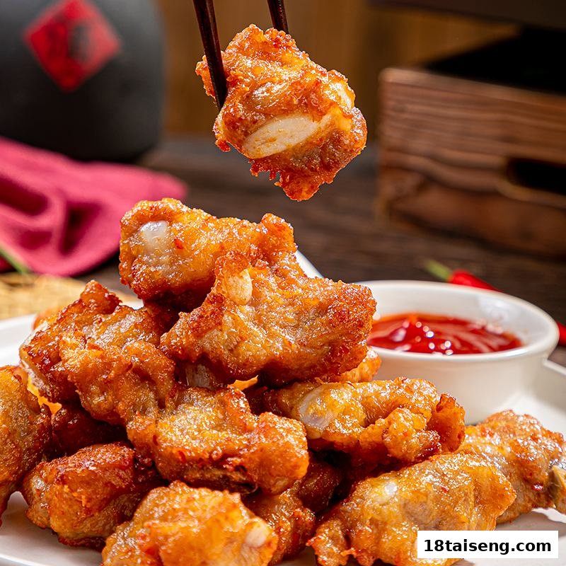 Close-up of crispy fried ribs or chicken pieces with a dipping sauce, held by chopsticks.