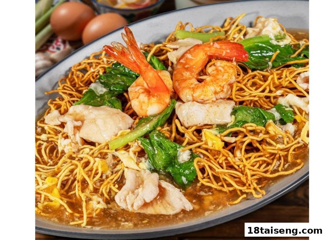A large plate of crispy noodles with prawns, chicken, vegetables, and savory gravy.