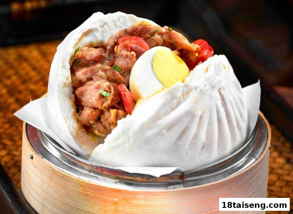 A large steamed bun (bao) filled with savory meat and a hard-boiled egg, served in a bamboo steamer.