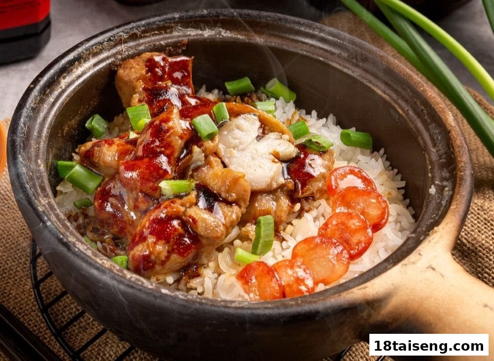 A steaming claypot rice dish with chicken, Chinese sausage, and green onions.