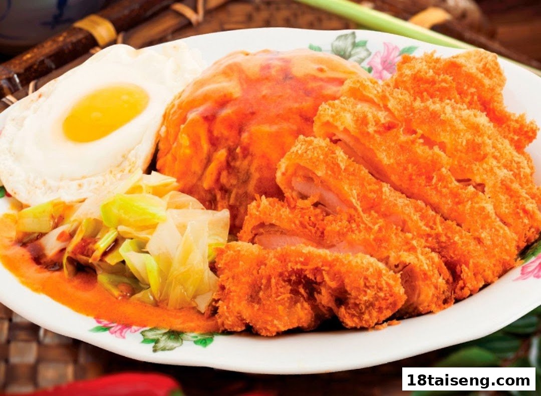A vibrant plate featuring crispy fried chicken cutlets, sauced rice, a fried egg, and stir-fried cabbage.