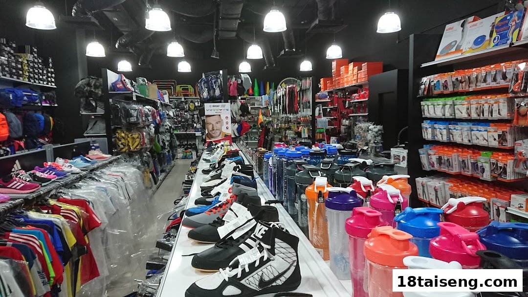 Interior view of Liang Seng Sports, showcasing a wide range of athletic footwear, apparel, and sports equipment.