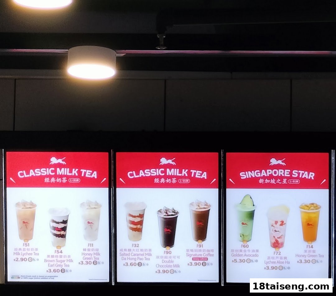 A brightly lit menu board displaying various bubble tea and beverage options with prices at LiHO TEA.