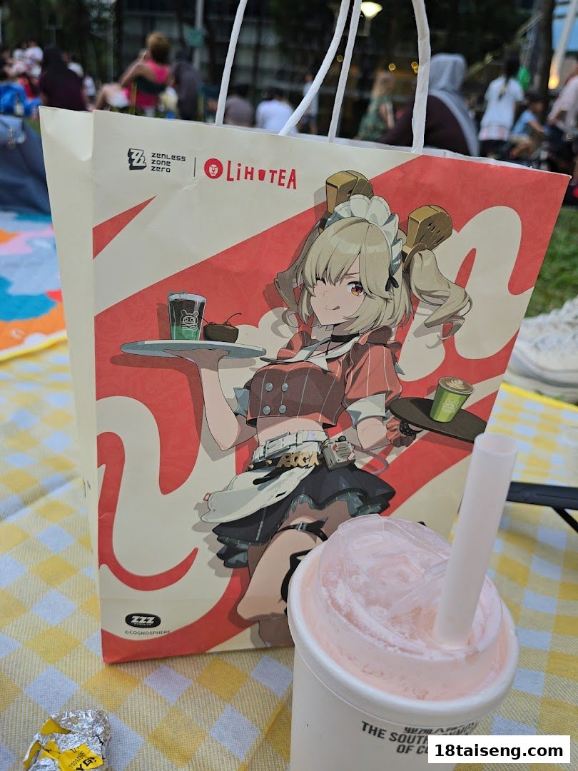 A LiHO TEA shopping bag featuring anime art and a refreshing drink on a checkered picnic blanket.