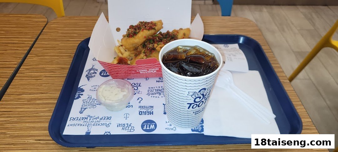 A delicious Long John Silver's meal featuring fish, fries, and a drink on a tray.