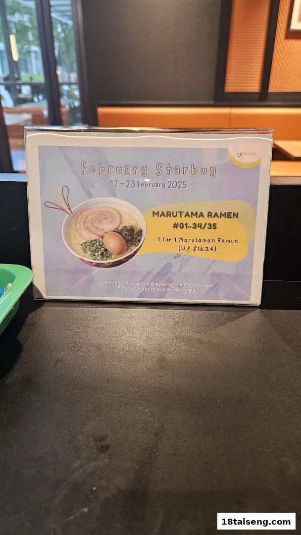 A promotional sign for Marutama Ramen's 'February Starbuy' offering a 1-for-1 deal on Marutaman Ramen.
