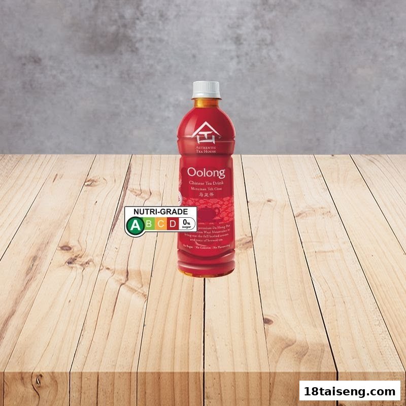 A bottle of Authentic Tea House Oolong Chinese Tea Drink with a Nutri-Grade A label on a wooden table.