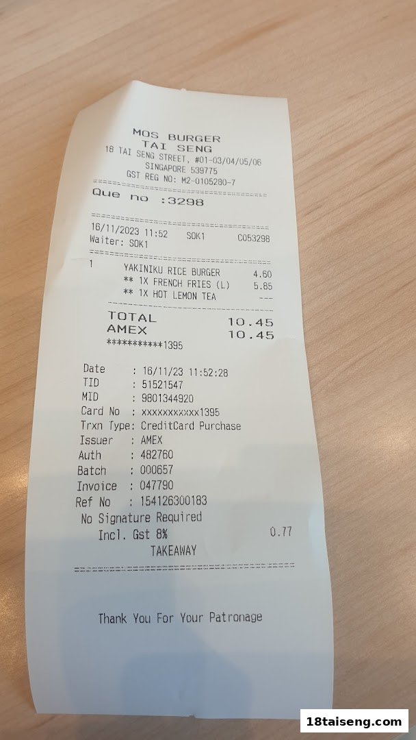 A close-up view of a MOS Burger receipt showing purchased items and transaction details.