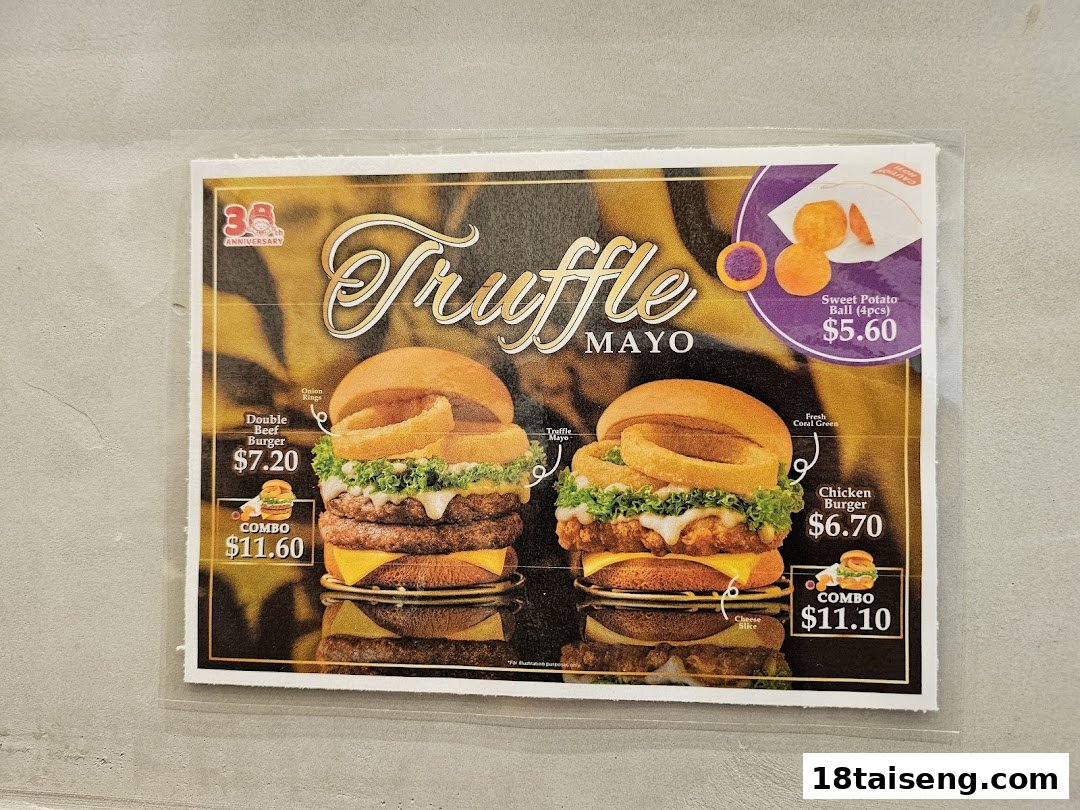 A menu board showcasing MOS Burger's limited-time Truffle Mayo burgers and sweet potato balls.