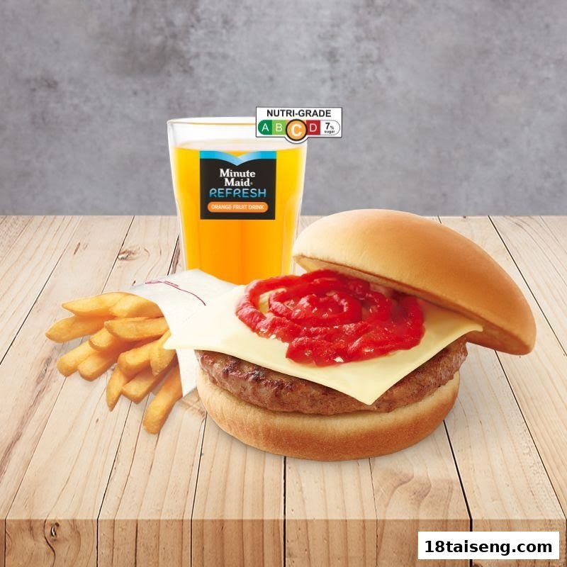 A delicious burger with cheese and ketchup, golden fries, and a refreshing orange drink.