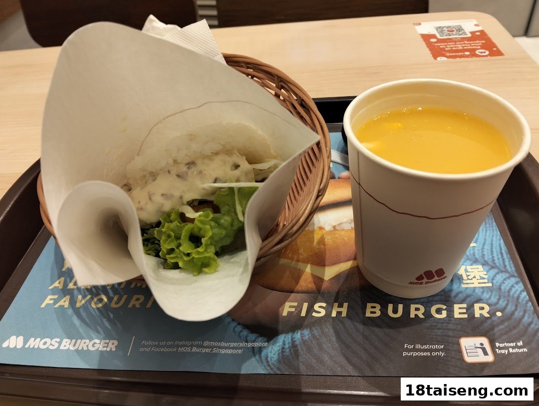 A MOS Burger meal featuring a rice burger and a drink on a branded tray.