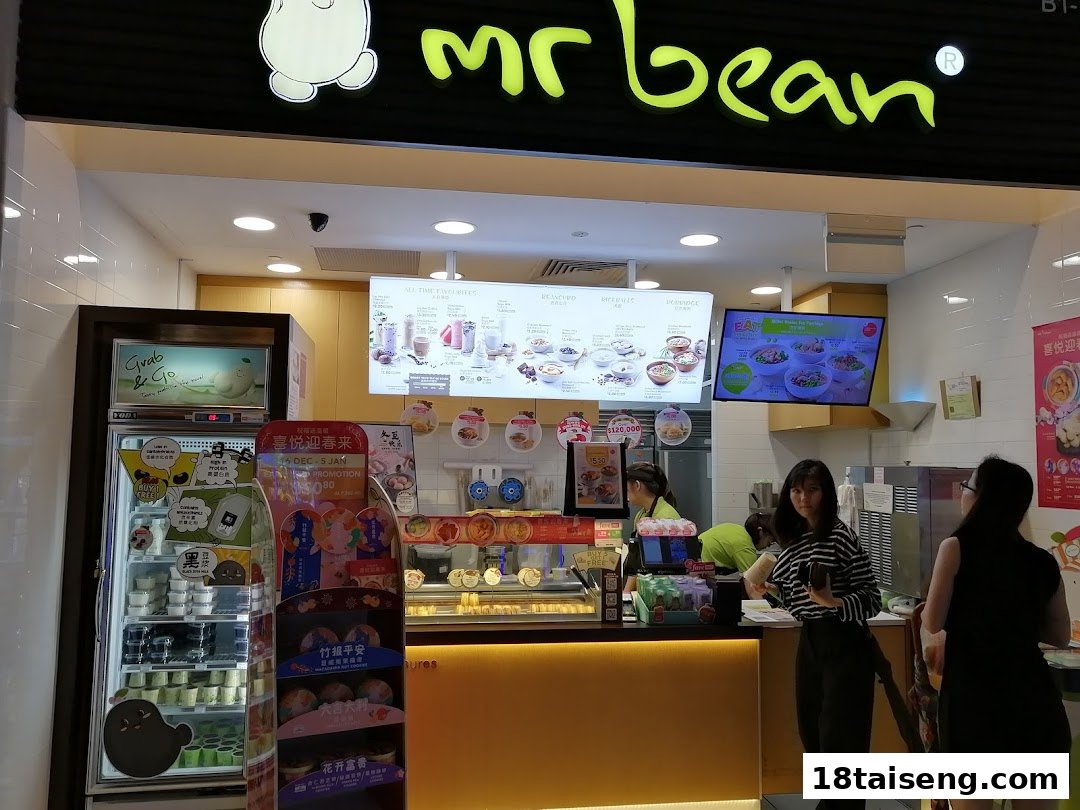 The vibrant Mr Bean shop front features a counter, digital menus, and a display of soy-based products.