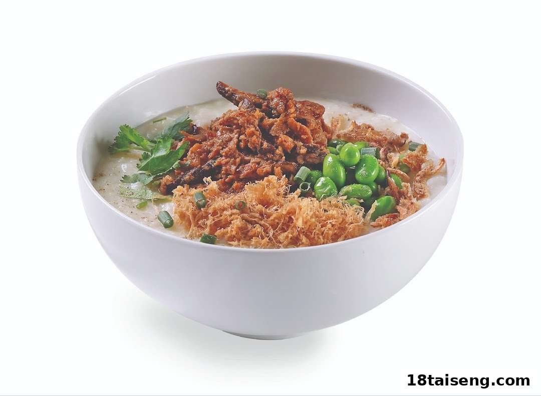 A delicious bowl of savory porridge topped with meat floss, edamame, and fried shallots.