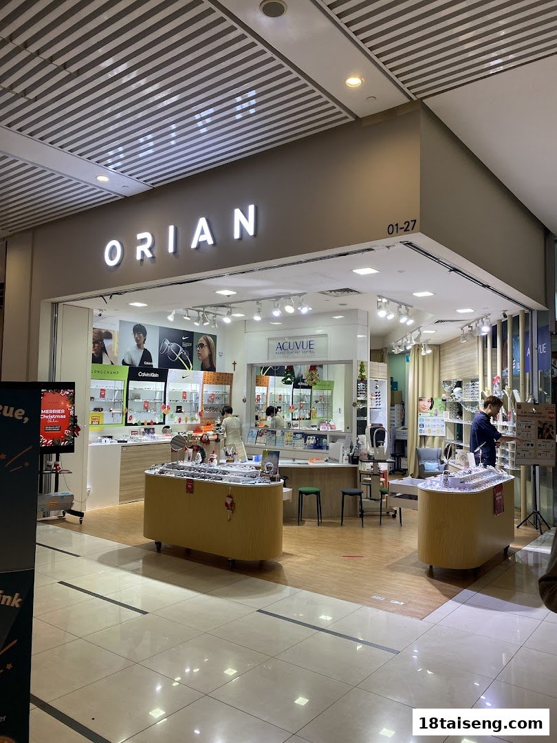 The brightly lit storefront of Orian, an eyewear shop, showcasing various glasses and contact lenses.