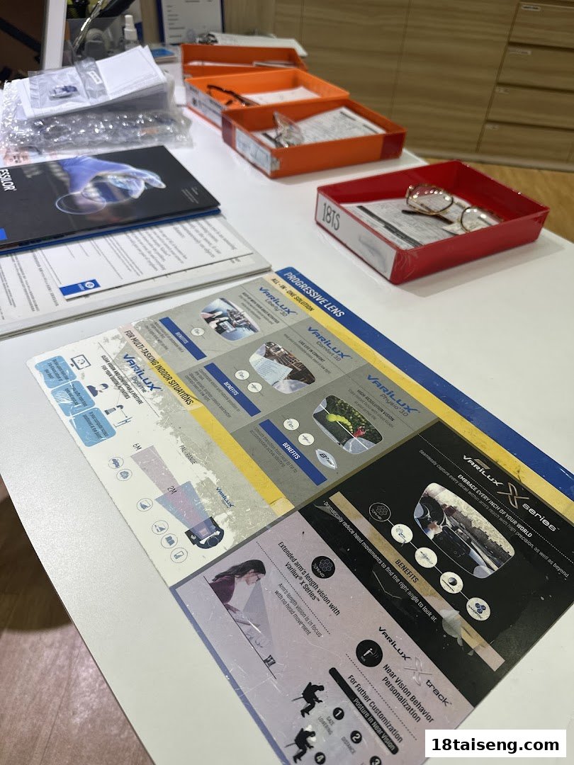 A table displaying optical products, brochures, and glasses in a retail setting.