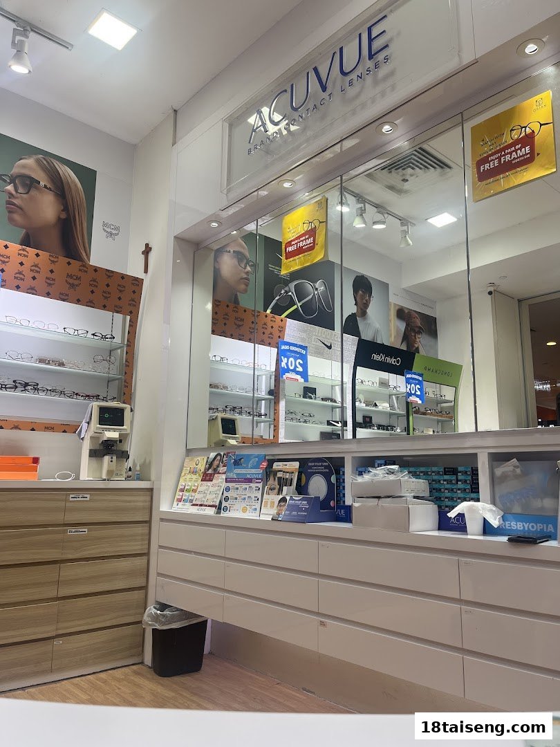 Interior view of an optical shop displaying eyeglasses, contact lenses, and promotional materials.