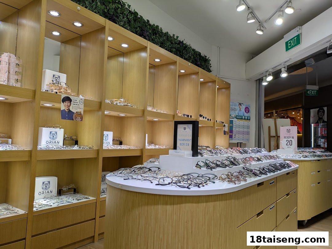 Interior of ORIAN optical shop showcasing a wide selection of eyeglasses on modern wooden displays.