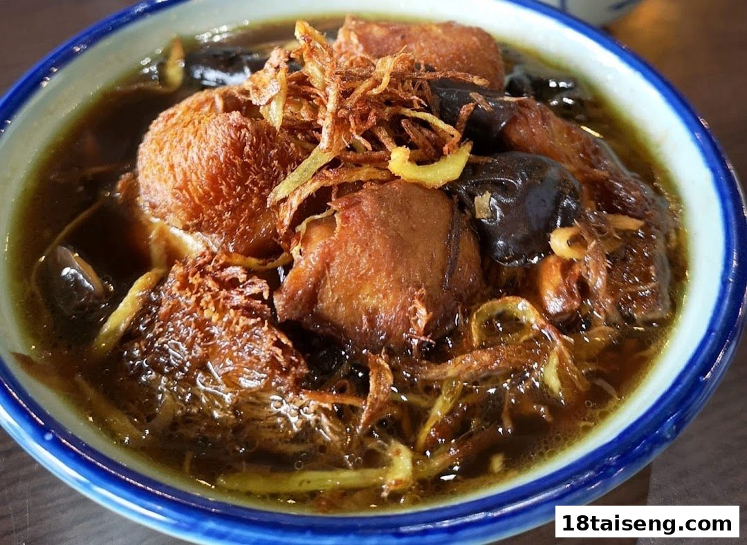 A close-up of a hearty vegetarian stew or soup, topped with crispy fried ingredients.