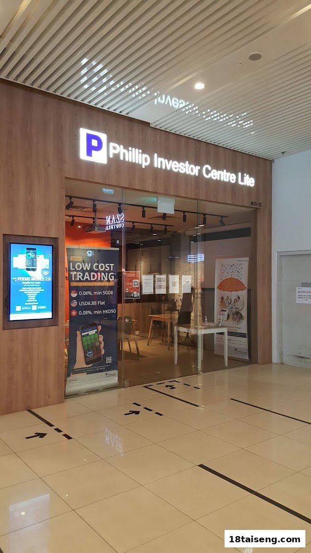 The exterior of Phillip Investor Centre Lite, featuring its entrance and promotional displays.